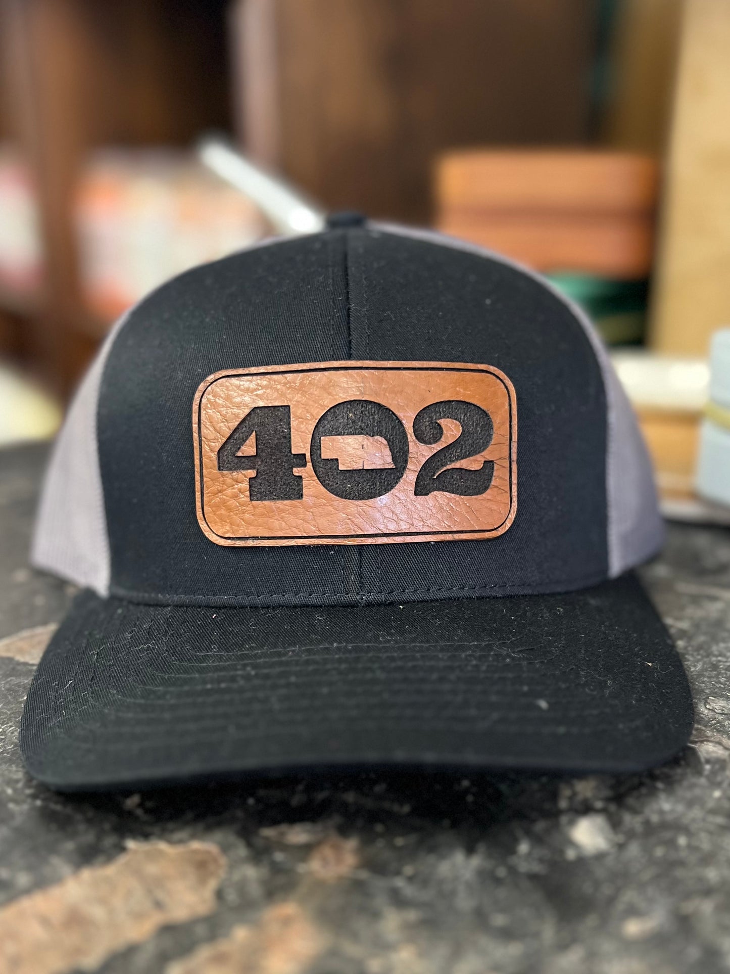402 Leather Patch 7 Panel Trucker Hat