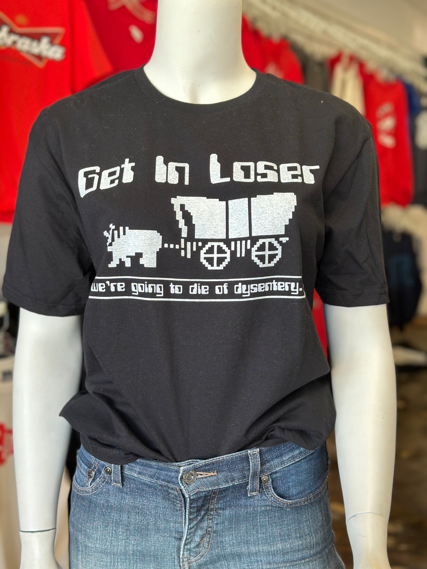 Get in Loser, We're Going to Die of Dysntery - Gildan Softstyle Unisex Tee